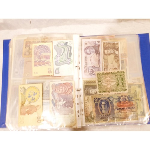 60 - A folder of world bank notes. UK shipping £14.