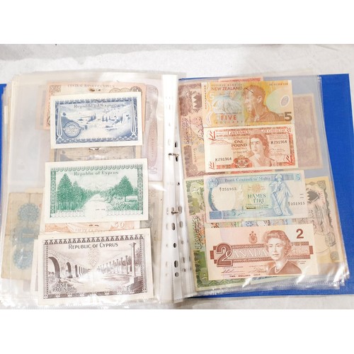 60 - A folder of world bank notes. UK shipping £14.