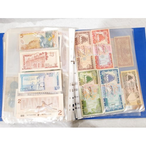 60 - A folder of world bank notes. UK shipping £14.