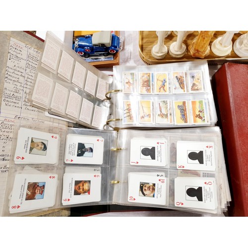 129 - A folder of cigarette cards and tea cards including The Beano, film and TV stars.  UK shipping £14.