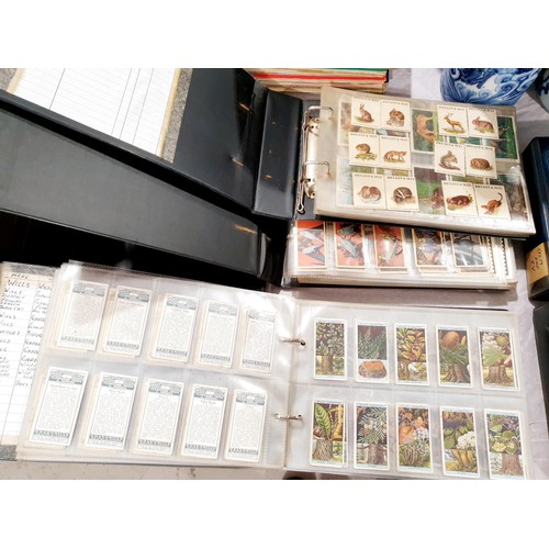 136 - Three folders of nature and wild life cigarette cards. UK shipping £14.