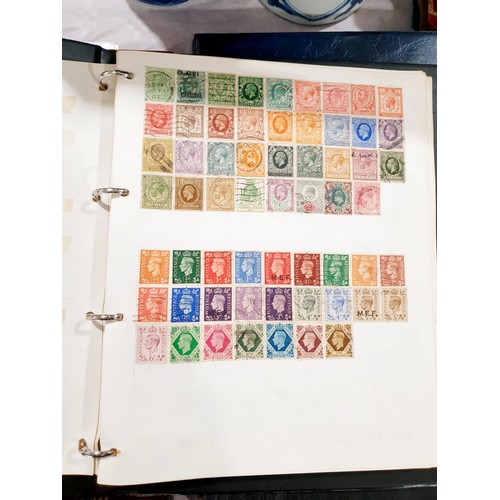 137 - A folder of stamps including a penny red. UK shipping £14.