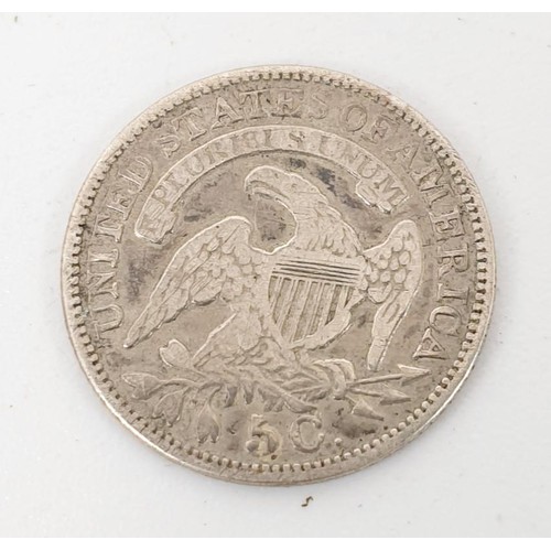 26 - United States of America: an 1830 5 cents coin, together with other coins. UK shipping £14.