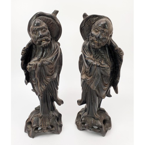 226 - Two Chinese carved wooden figures, height 27cm. UK shipping £14.