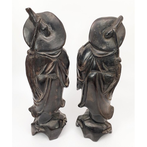 226 - Two Chinese carved wooden figures, height 27cm. UK shipping £14.