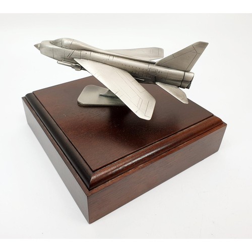 249 - A pewter model of an English Electric Lightening fighter jet, the base 16x16cm. No shipping. Arrange... 