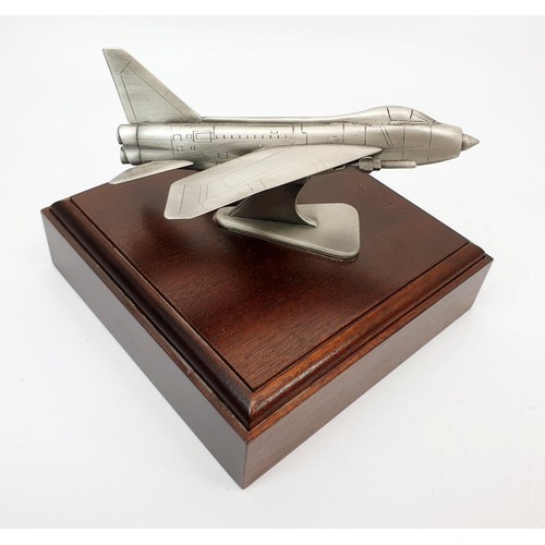 249 - A pewter model of an English Electric Lightening fighter jet, the base 16x16cm. No shipping. Arrange... 