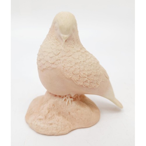 252 - A Carinia coral carving of a bird, height 10cm. No shipping. Arrange collection or your own packer a... 