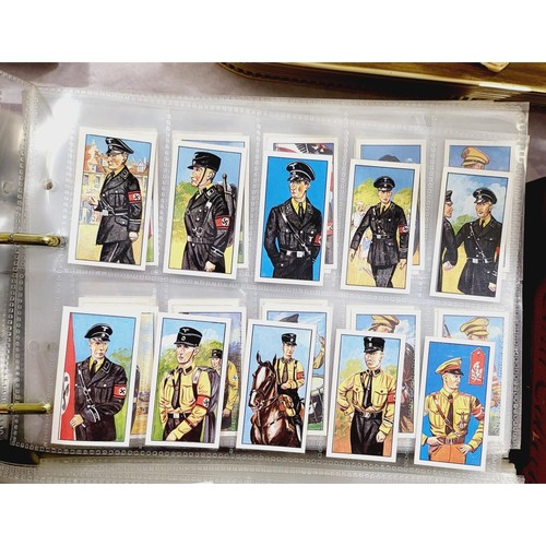 130 - A folder of military cigarette and tea cards including uniforms of the Third Reich. UK shipping £14.