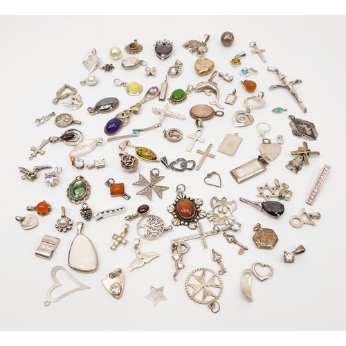 11 - A selection of silver pendants and charms, gross weight 155g. UK shipping £14.