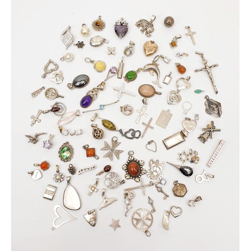 11 - A selection of silver pendants and charms, gross weight 155g. UK shipping £14.