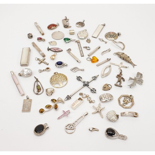 12 - A selection of silver pendants, gross weight 155g. UK shipping £14.