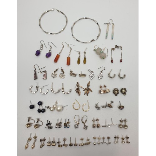 13 - A selection of silver earrings, gross weight 95g. UK shipping £14.