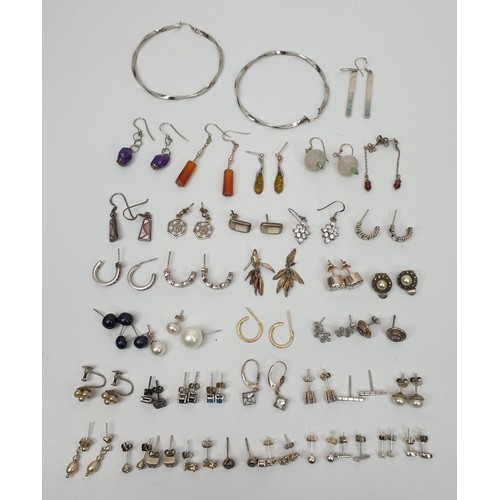 13 - A selection of silver earrings, gross weight 95g. UK shipping £14.