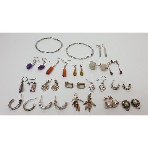 13 - A selection of silver earrings, gross weight 95g. UK shipping £14.