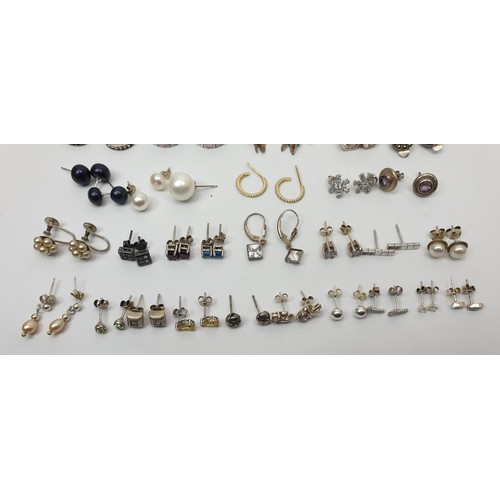 13 - A selection of silver earrings, gross weight 95g. UK shipping £14.