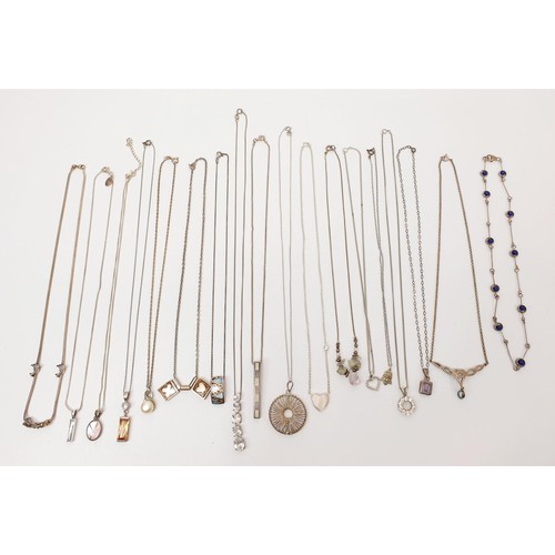 19 - A selection of silver pendants and chains, gross weight 90g. UK shipping £14.