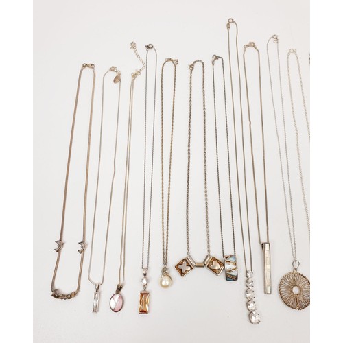 19 - A selection of silver pendants and chains, gross weight 90g. UK shipping £14.