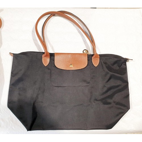 34 - Four Longchamp bags. UK shipping £14.