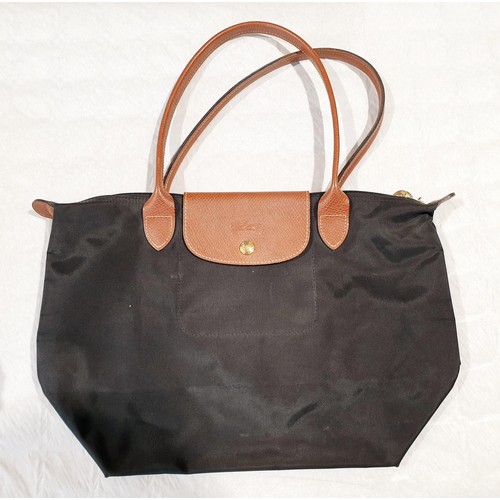 34 - Four Longchamp bags. UK shipping £14.