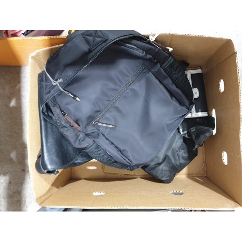 84 - Three boxes of bags including a Clarks rucksack, Diesel, Kenneth Cole, Fossil and IT Luggage bags. U... 