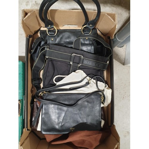 84 - Three boxes of bags including a Clarks rucksack, Diesel, Kenneth Cole, Fossil and IT Luggage bags. U... 