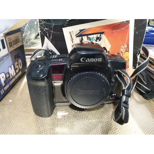 85 - A Canon EOS10 camera body, a Polaroid Land Camera and a Samsun VP-M50 video camera. UK shipping £14.