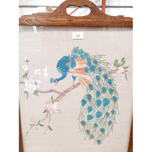 137 - A vintage oak fire screen with needlework insert, height 77.5cm. No shipping. Arrange collection or ... 