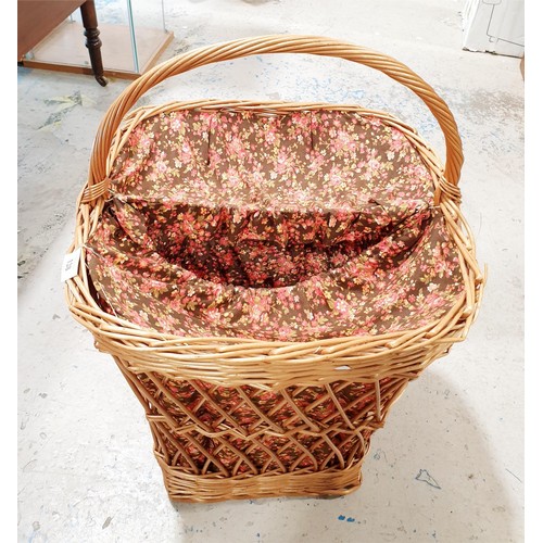 138 - A wicker linen bin, height 70cm. No shipping. Arrange collection or your own packer and shipper, ple... 