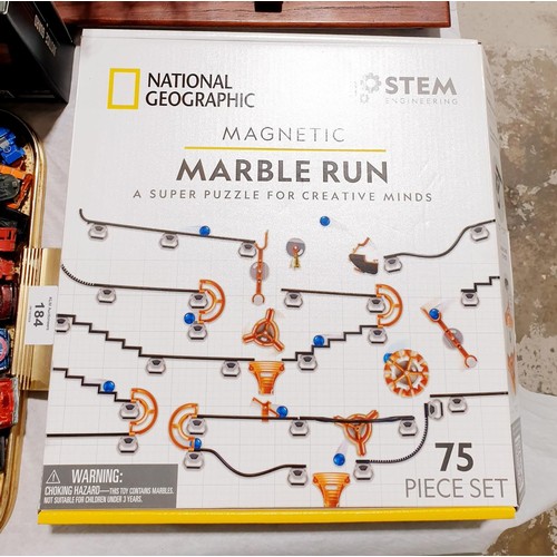 182 - A National Geographic magnetic marble run game together with a plastic head. UK shipping £14.