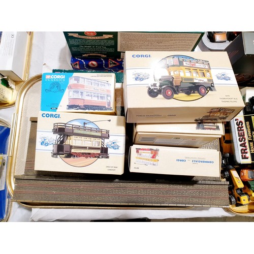 185 - Boxed Corgi trams and a bus together with a display stand which is A/F. UK shipping £14.