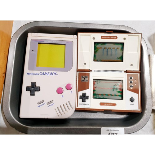 187 - A vintage Nintendo game and watch, Donkey Kong II together with a Nintendo Gameboy. UK shipping £14.... 