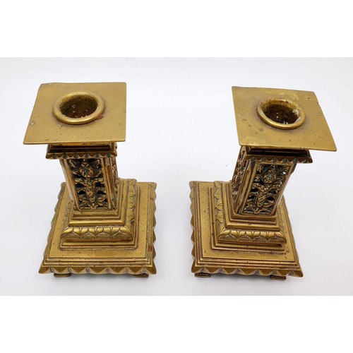 221 - A pair of Victorian brass candlesticks of classical form with pierce work columns, height 14.5cm. UK... 