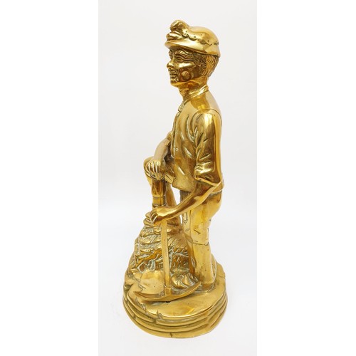 226 - A brass figure of a miner, height 29.5cm. UK shipping £14.