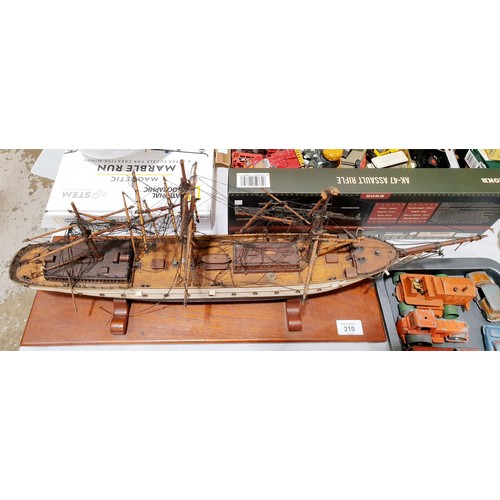 210 - A wooden model of a sailing ship, length 57cm, A/F. No shipping. Arrange collection or your own pack... 