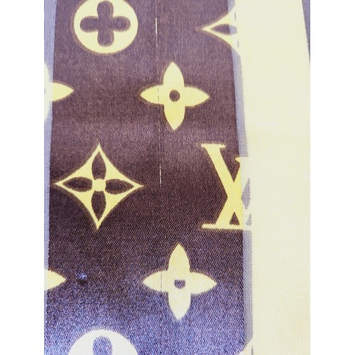 288 - A Louis Vuitton silk scarf. UK shipping £14.