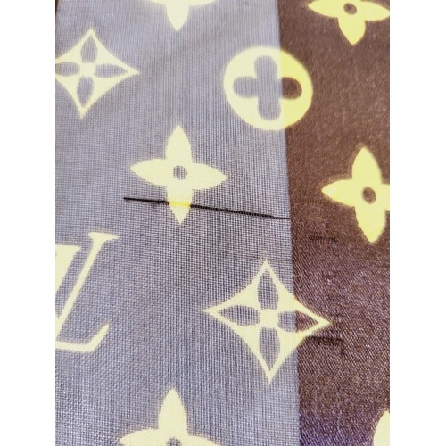 288 - A Louis Vuitton silk scarf. UK shipping £14.