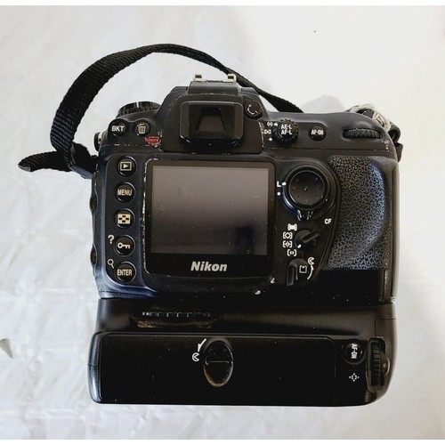 272 - A Nikon D200 camera with an AF-S Nikkor 17-55mm lens. UK shipping £14.