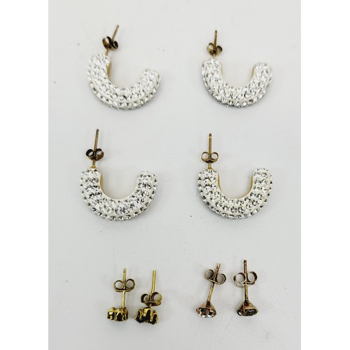 24 - Two pairs of stone set 9ct gold earrings, gross weight 1g together with yellow metal earrings and co... 