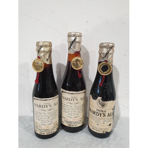 12 - Three bottles of Thomas Hardy's Ale, 1980 & 1981, with four miniature Guinness and Mackesons bottles... 