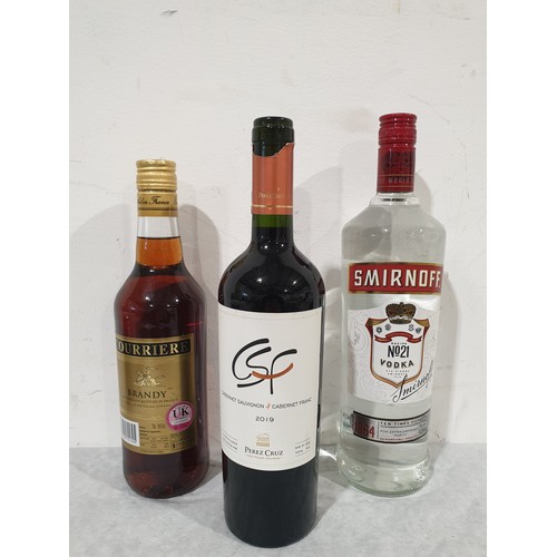 16 - A 1ltr bottle of Smirnoff vodka, 70cl of Courriere brandy & a bottle of Perez Cruz Cabernet Sauvigno... 