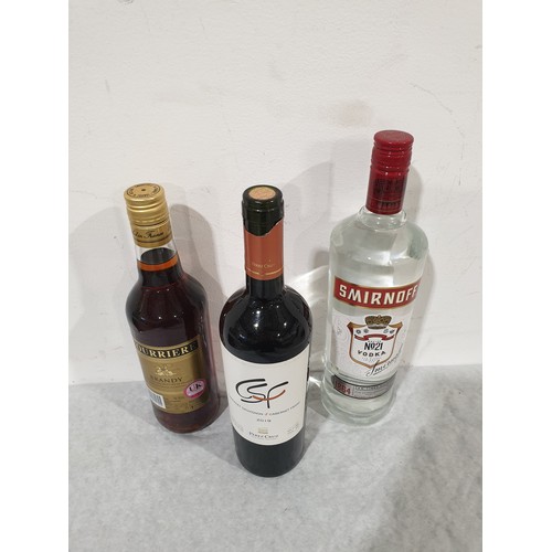 16 - A 1ltr bottle of Smirnoff vodka, 70cl of Courriere brandy & a bottle of Perez Cruz Cabernet Sauvigno... 