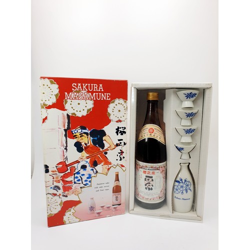 23 - Sakura-Masamune; a cased set, to include sealed 720ml bottle, sake server and four cups. No shipping... 