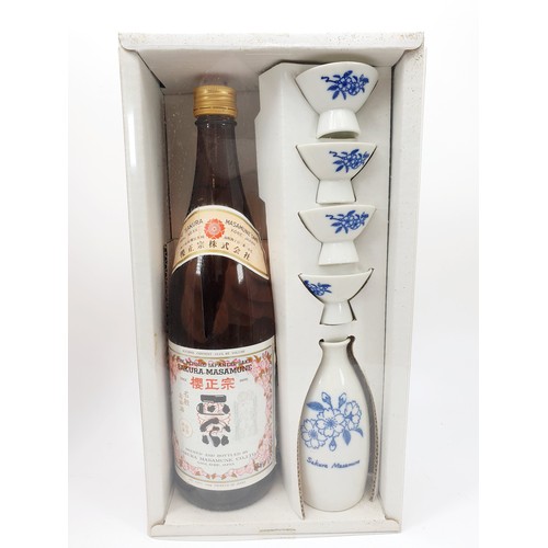 23 - Sakura-Masamune; a cased set, to include sealed 720ml bottle, sake server and four cups. No shipping... 