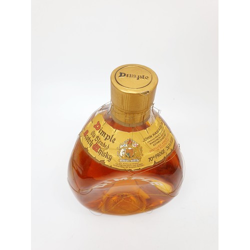 34 - A vintage bottle of Haig's Dimple old blended scotch whisky, in presentation box, 26.2/3fl.ozs. No S... 