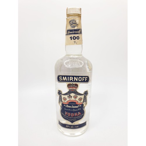 36 - A 1ltr bottle of vintage Canadian blue label Smirnoff vodka. No shipping. Arrange collection or your... 