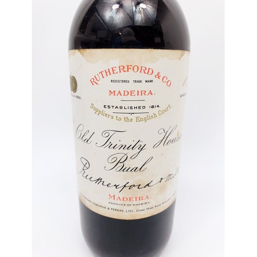 38 - A vintage bottle of Rutherford & Co Old Trinity House Bual Madeira. No shipping. Arrange collection ... 