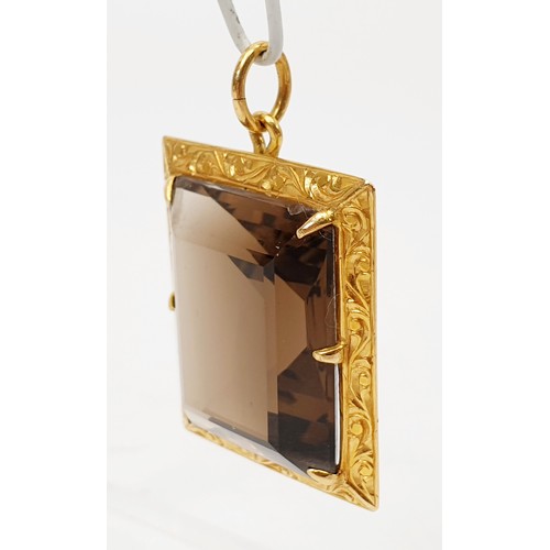 43 - A smokey quartz in a yellow metal pendant mount, A/F, length 4cm. UK shipping £14.