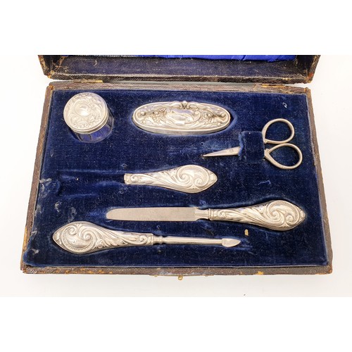 59 - A cased hallmarked silver manicure set, Birmingham 1916. UK shipping £14.