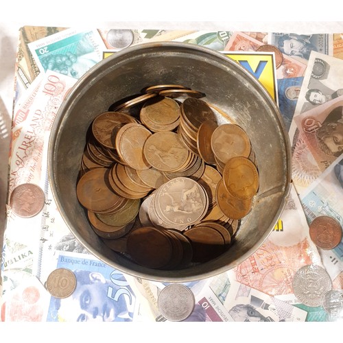 105 - A folder of British coinage and a tin of British pennies. UK shipping £14.